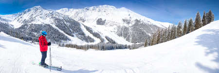 Man enjoying the stunning view before skiing in famous ski resort in Tyrolian Alps, Zillertal, Austriaの写真素材