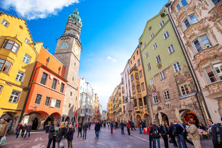 INNSBRUCK, AUSTRIA - March 11, 2017 - People in Innsbruck city center under Stadtturm tower. It is capital sity of Tyrol in western Austria, Europe.のeditorial素材