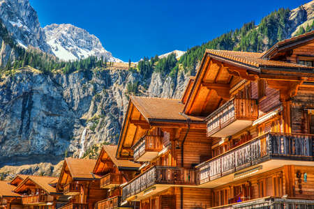 Colorful wooden houses with flowers in Kandersteg village, Canton Bern, Switzerland, Europe.の写真素材