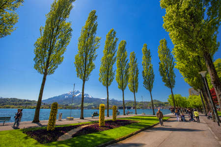 LUCERNE, SWITZERLAND - May 2016 - Lucerne promenade with Pilatus mountain and Lucerne lake, Switzerland, Europe.のeditorial素材