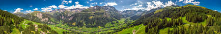 Aerial view of Elm village and Swiss mountains - Piz Segnas, Piz Sardona, Laaxer Stockli from...