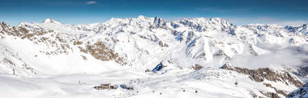 Skiers skiing on the top of Presena Glacier, Tonale, Italy.の写真素材