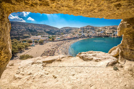 Matala beach on Crete island with azure clear water, Greece, Europe. Crete is the largest and most populous of the Greek islands.の写真素材
