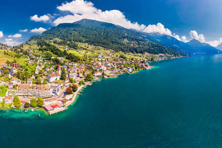 Village Weggis, lake Lucerne (Vierwaldstatersee), Rigi mountain and Swiss Alps in the background near famous Lucerne city, Switzerland.の写真素材
