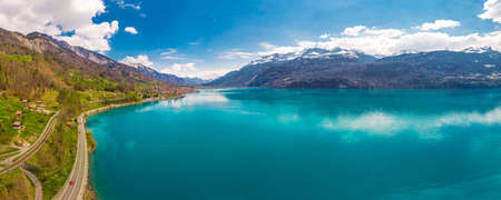 Brienz town on lake Brienz by Interlaken with the Swiss Alps covered by snow in the background, Switzerland, Europeの写真素材
