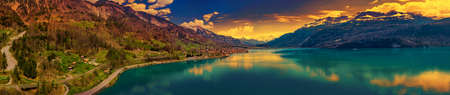 Brienz town on lake Brienz by Interlaken with the Swiss Alps covered by snow in the background,...