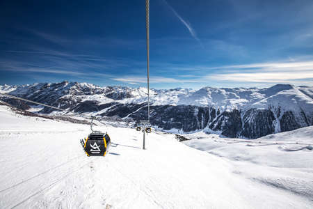 LIVIGNO, ITALY - Feb. 2019 - Skiers skiing in Carosello 3000 ski resort, Livigno, Italy, Europe.のeditorial素材