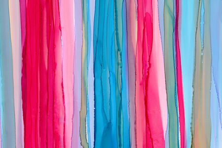 Vertical hand drawn pink and blue liquid ink colors blending. Bright colorful watercolor background. Vibrant aquarelle smears wallpaper alcohol ink. Aquarelle brush strokes, touches, drops and spots.の写真素材