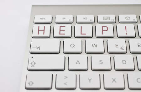 red "HELP!" on white keyboardの写真素材