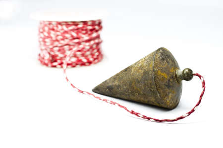 used plumb bob on white background の写真素材