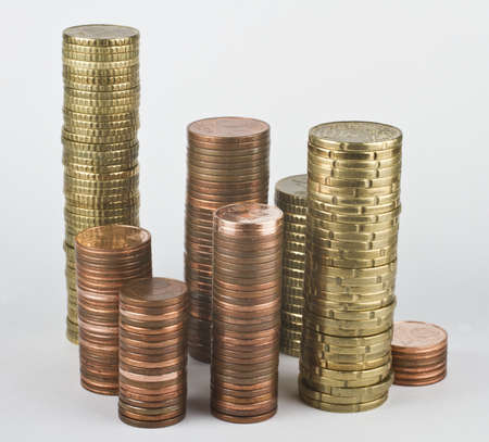 stacks of euro coins in grey backgroundの写真素材