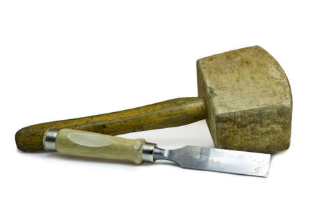 used wooden hammer and chisel on white background. These work tools are used by the cabinetmaker.の写真素材
