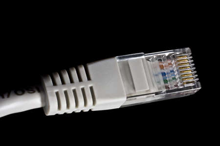 single, grey network plug in black backgroundの写真素材