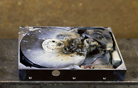dead hard drive in close up. rusty backgroundの写真素材