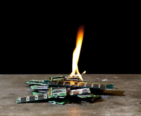 burning memory modules in black backgroundの写真素材