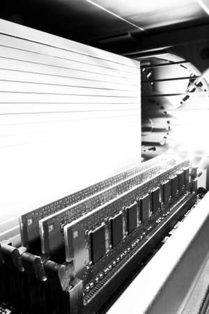 three main memory modules in computer chassis with fan in backgroundの写真素材