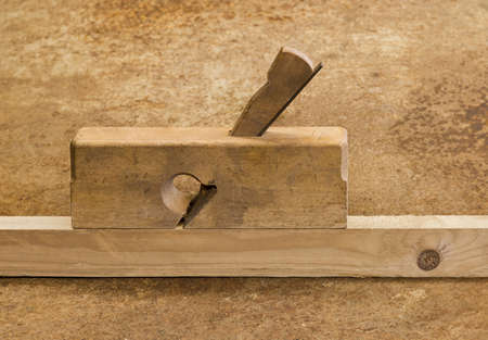 planer on wood in brown background.の写真素材