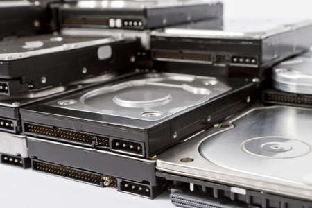 stack of hard drives with different connectorns in close up shotの写真素材