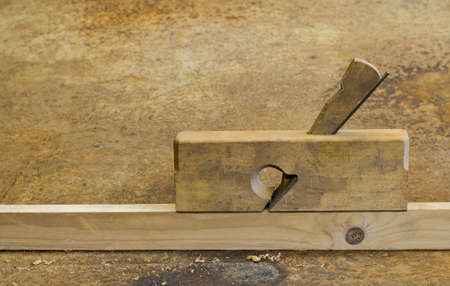 small planer on wood in rusty backgroundの写真素材