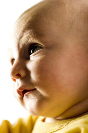 young child looking to the left in dramatic light