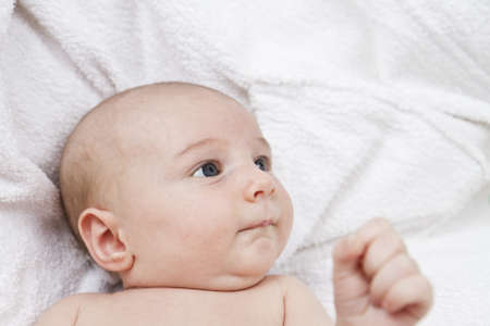 nursling looking at side. naked. shot of head and upper torsoの写真素材