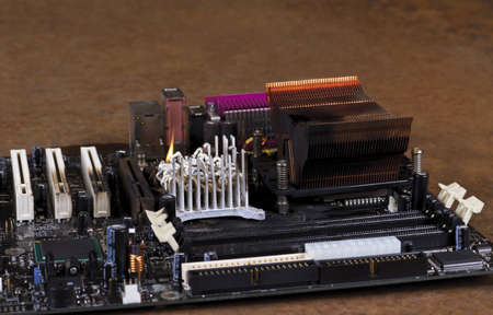 molten cooling element on computer main board. Rusty backgroundの写真素材
