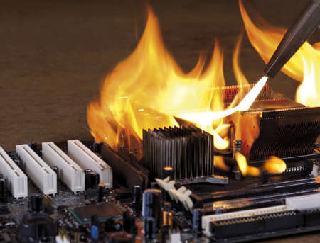 burning computer main board in rusty background. Copyspaceの写真素材