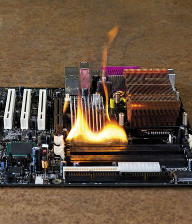 burning computer main board in rusty backgroundの写真素材