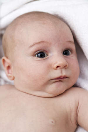 nursling looking at side. naked. shot of head and upper torsoの写真素材