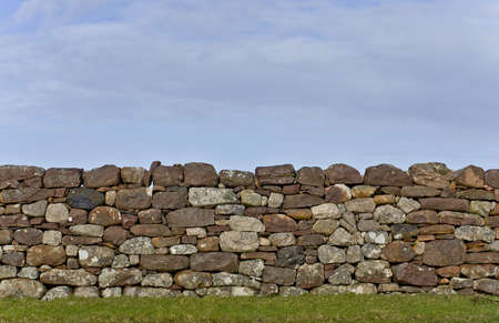 scottish stone wall in evening light. detail shot. vertical imageの写真素材
