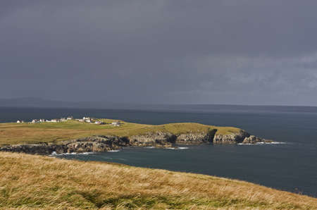 coastal landscape on scottish isle with wetland and hillsの写真素材