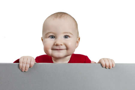 young child holding shield. isolate on white backgroundの写真素材