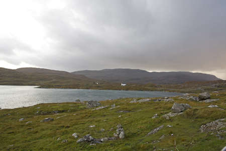 coastal landscape on scottish isle with wetland and hillsの写真素材