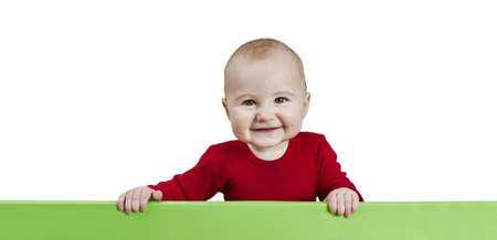 young child holding green sign. isolate on white backgroundの写真素材