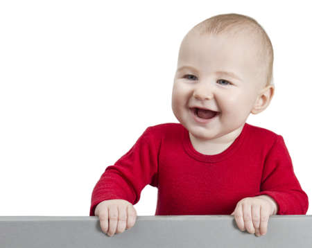 young child with red shirt holding shield. isolate on white backgroundの写真素材