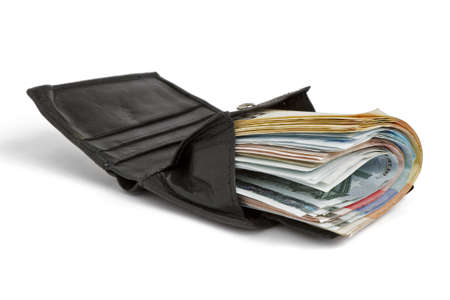 many banknotes in black wallet on white background with shadowの写真素材