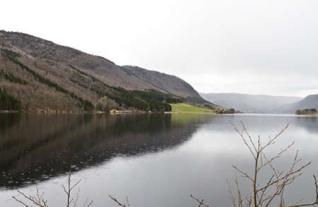 fjord in norway with raindrops falling in waterの写真素材