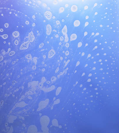 abstract wet blue background with soap bubble conglomerationsの写真素材