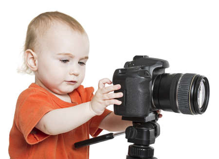 young child with digital SLR camera isolated on white backgroundの写真素材