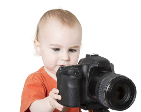 young child with digital SLR camera isolated on white backgroundの写真素材