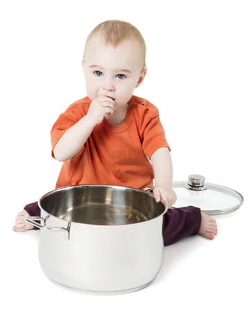 baby with big cooking pot isolated on white backgroundの写真素材