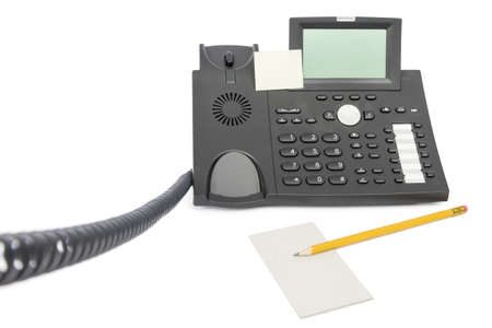 modern business phone with memo and pencil isolated on white backgroundの写真素材