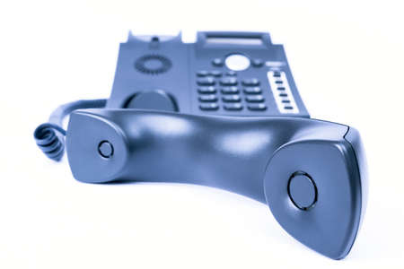 simple blue business phone on white background  telephone receiver in the front