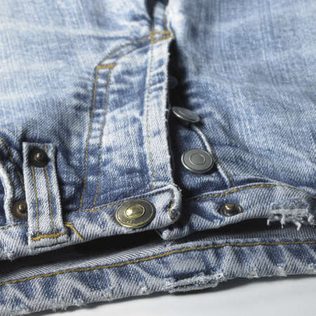 studio shot of a pair of jeans detail in white back, with clipping pathの写真素材