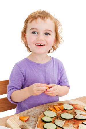 cute laughing girl making pizza  isolated in white backgroundの写真素材