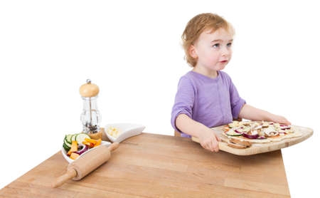 child with home made pizza  studio shot isolated on white backgroundの写真素材