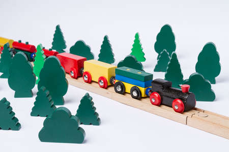 fast train driving through small forest  scenery made of wooden toyの写真素材