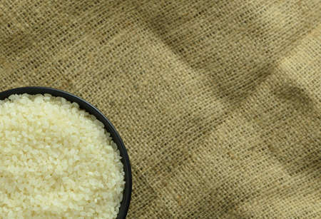 japanese rice in a black bowl on backgroundの写真素材