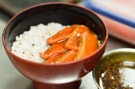 Salmon sushi put on rice mix vinegar,salt,sugar in restaurant japanの写真素材