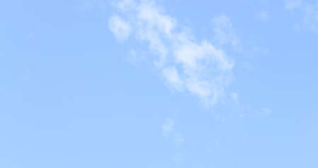 White fluffy clouds in  blue sky and spaceの写真素材